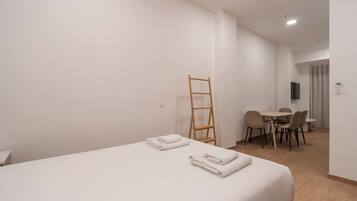 Iron/ironing board, travel crib, free WiFi, bed sheets