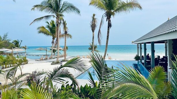 A resort with a pool, palm trees, and a beach view. - Apsara Resort Koh Rong (Koh Rong)