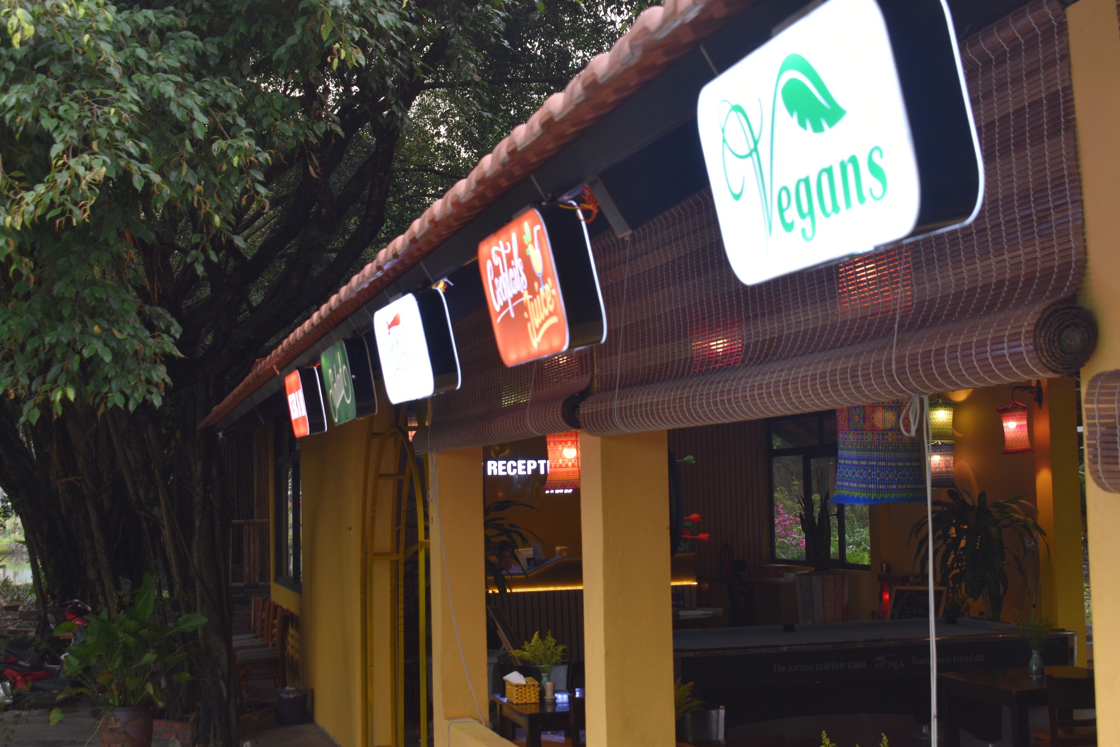 A restaurant with a sign indicating it is vegan-friendly.