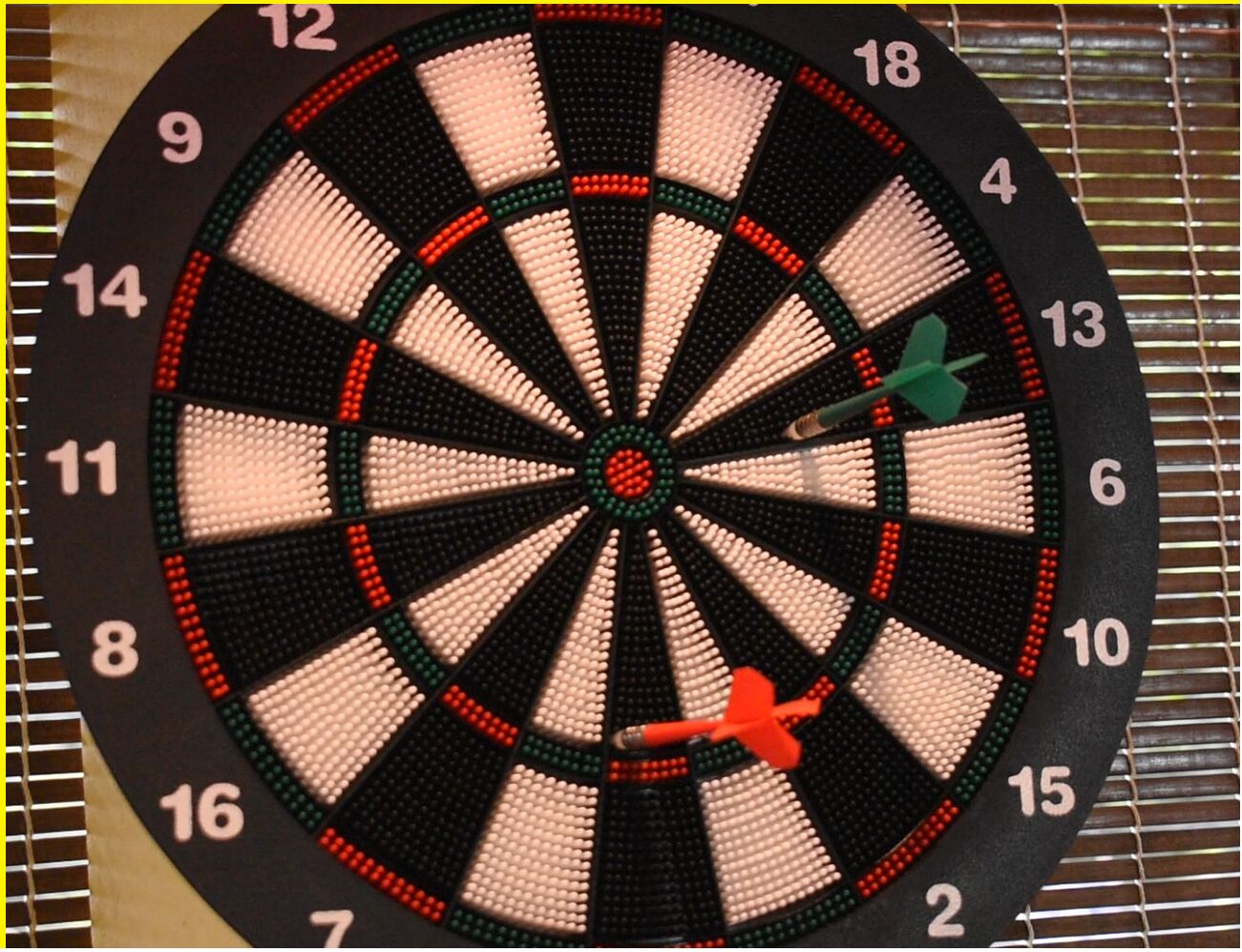 A dartboard with a dart in the 20 section.