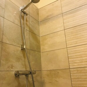 Shower, hair dryer, towels, soap