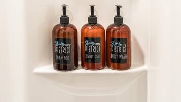 Shower, hair dryer, towels, shampoo