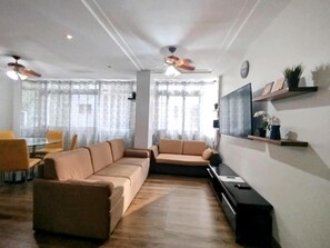 Family Condo | Living area | 32-cm TV with cable channels