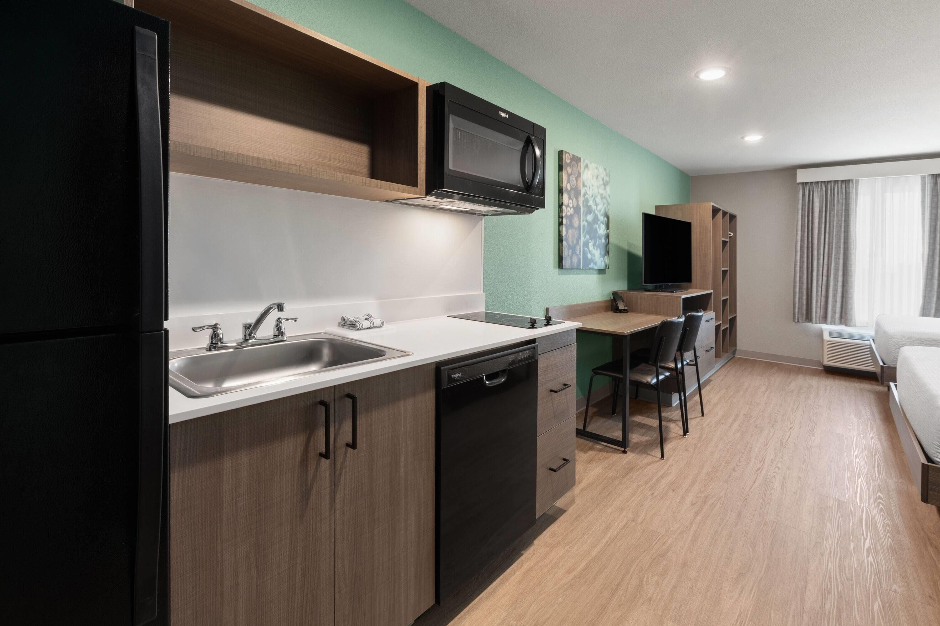Suite, 2 Queen Beds, Non Smoking | Desk, laptop workspace, WiFi (free), bed sheets