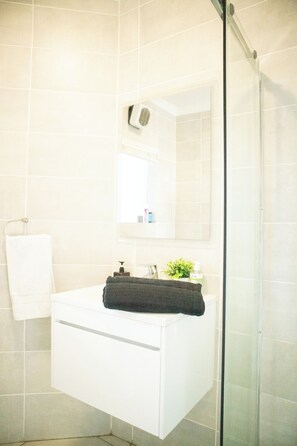 Shower, towels, soap, shampoo