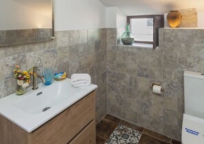 Shower, hair dryer, towels, toilet paper