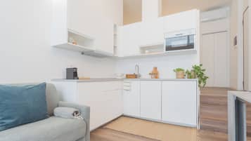 Apartment (1 Bedroom) | Living area | 32-inch flat-screen TV with satellite channels