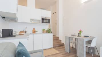 Apartment (1 Bedroom) | Living area | 32-inch flat-screen TV with satellite channels