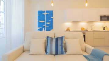 Apartment (1 Bedroom) | Living area | 32-inch flat-screen TV with cable channels