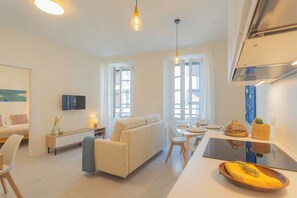 Apartment (1 Bedroom) | Living area | 32-inch flat-screen TV with cable channels