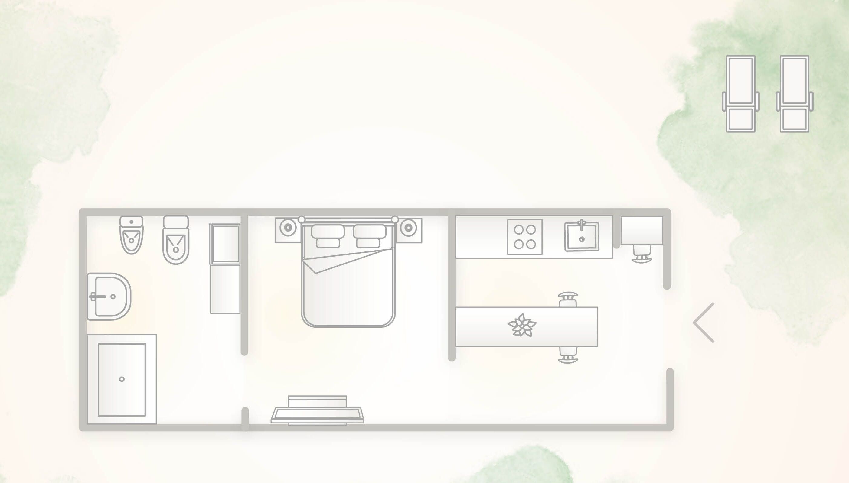 A floor plan of a hotel room with a bed, a desk, a bathroom, and a kitchenette.