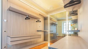 A modern bathroom with a wooden vanity, a mirror, and a towel rack. - Pantero Apartment by Rent all Como (Como)