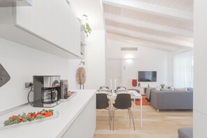 Apartment (2 Bedrooms) | Living area | 32-inch flat-screen TV with cable channels - Palazzo Tatti by Rent all Como (Como)