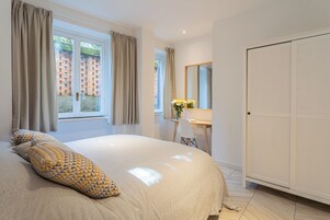 Apartment, 2 Bedrooms (2 Bedrooms) | 2 bedrooms, laptop workspace, iron/ironing board, bed sheets