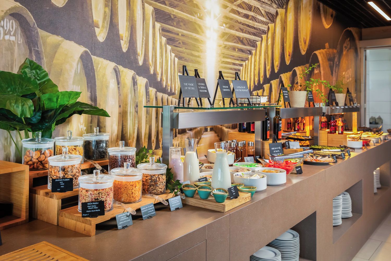 A buffet setup with various food items and condiments.