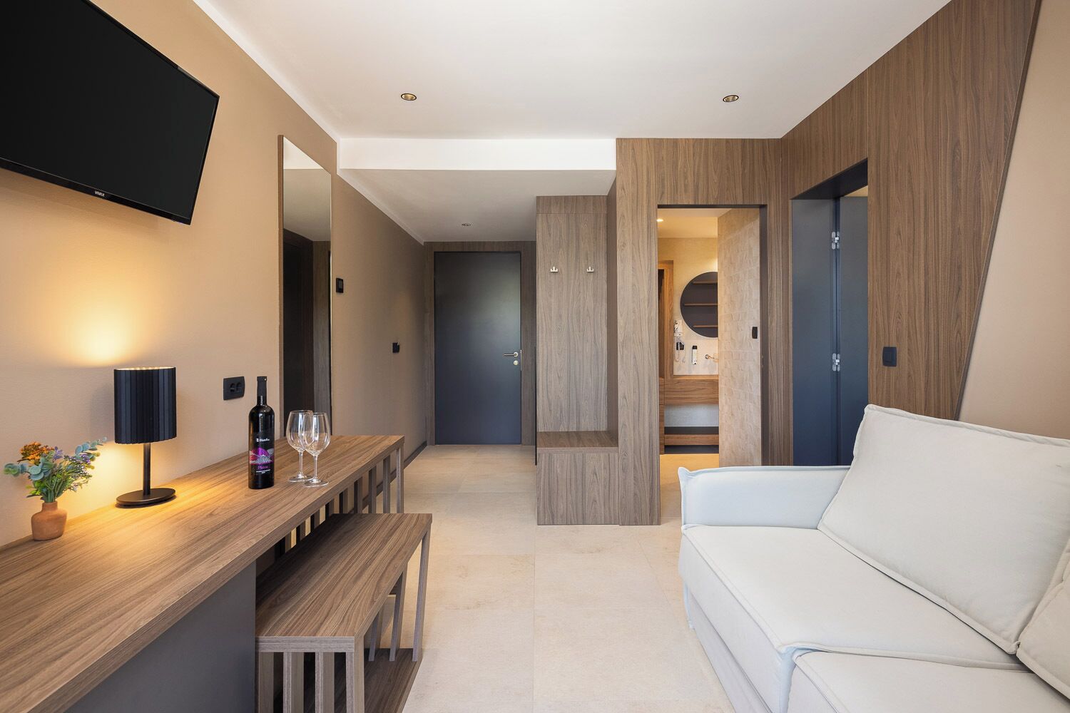 Premium suite with balcony and partial sea view | Living area | TV