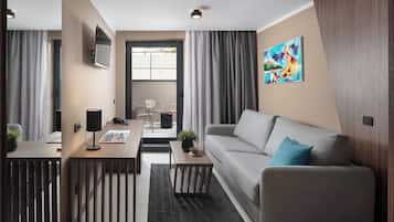 Premium suite with balcony | Living area | TV