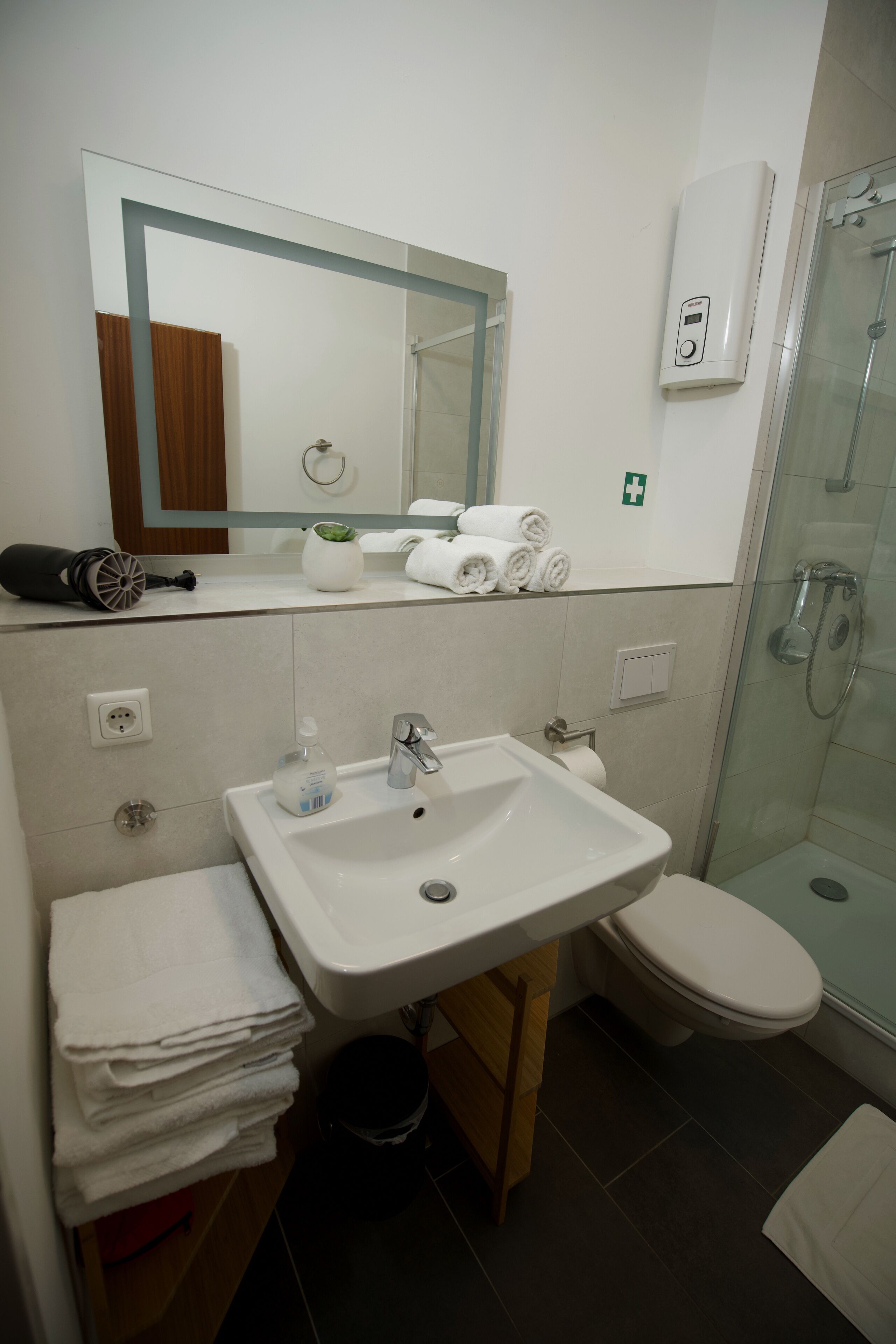 Shower, hair dryer, towels, soap