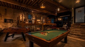 A billiards room with a pool table, a foosball table, and a dartboard. - Renovated, spacious and comfortable 26-bed mill (Saint-Ignat)