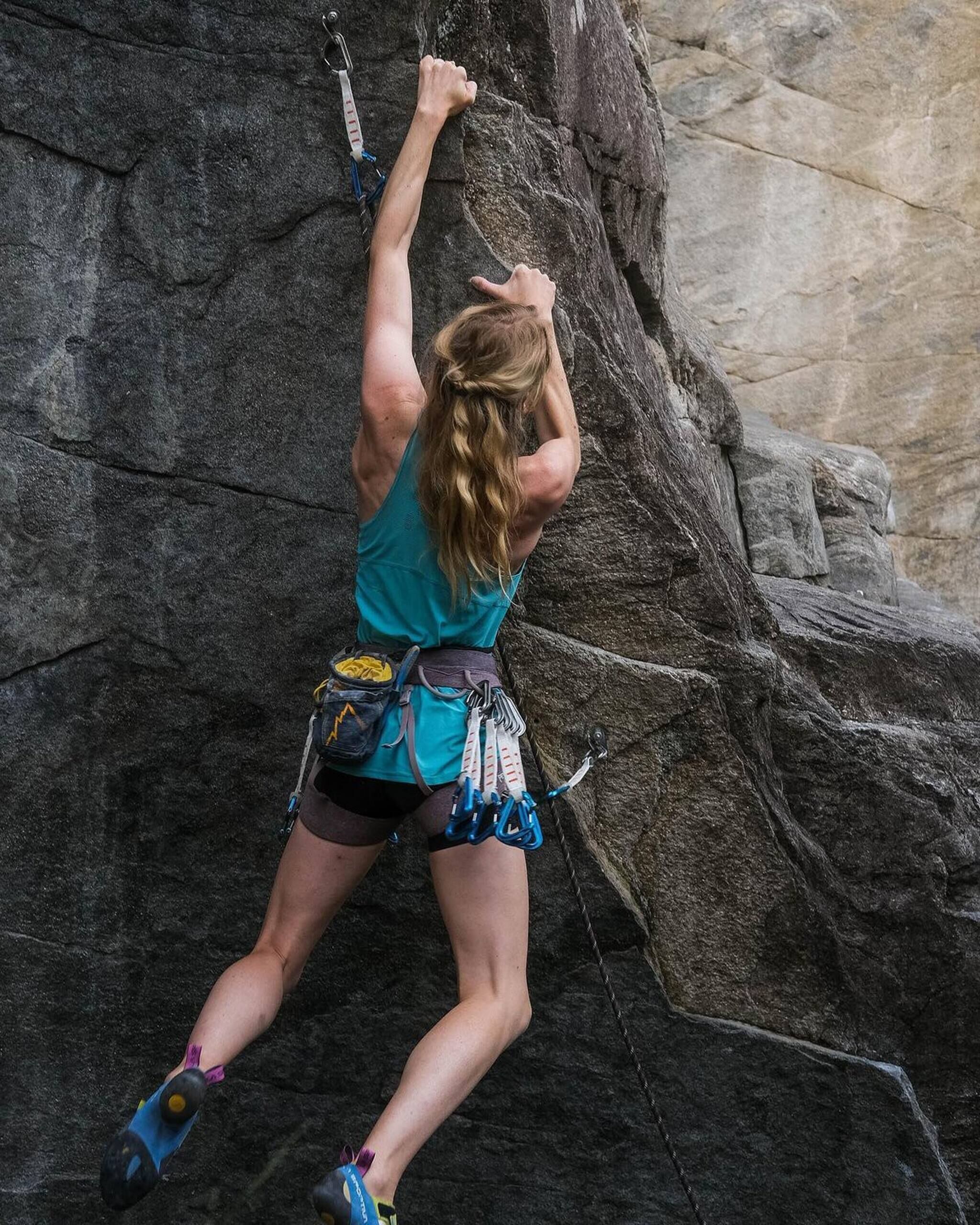 A person climbing a rock face.