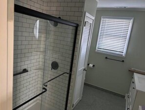 Shower, towels, soap, toilet paper