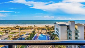 A hotel with a pool, beach view, and parking area. - Ocean Forest Plaza 708 - Oceanfront (Myrtle Beach)