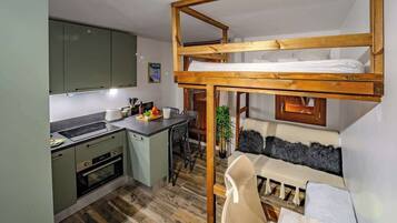 1 bedroom, desk, iron/ironing board, travel crib