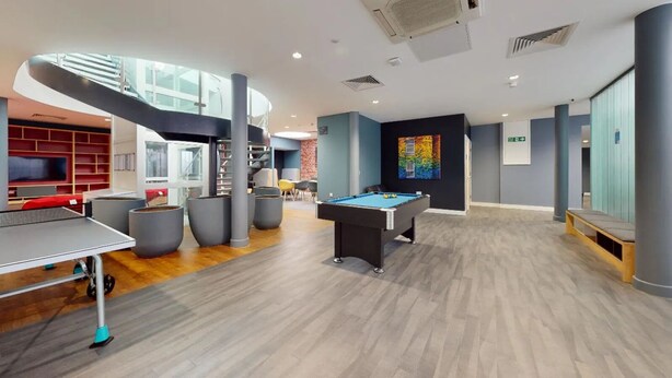 A modern recreational area with a pool table, ping pong table, and seating areas. - Student Only Will Wyatt Court (London)