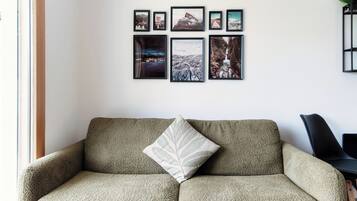 Deluxe Apartment, Garden View | Living area | 32-inch flat-screen TV with satellite channels