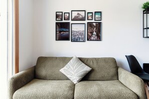 Deluxe Apartment, Garden View | Living area | 32-inch flat-screen TV with satellite channels