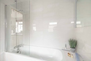 Shower, hair dryer, towels, shampoo