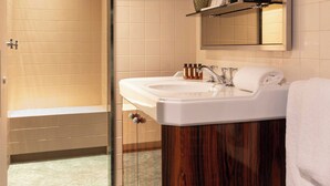A modern bathroom with a glass shower enclosure, a wooden vanity, and a mirror above the sink. - Palais Bourbon Hotel - Room 34 - 2P - Invalides (Paris)