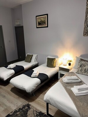 Economy Quadruple Room | 1 bedroom, desk, iron/ironing board, free WiFi