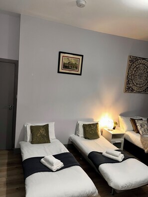 Economy Quadruple Room | 1 bedroom, desk, iron/ironing board, free WiFi
