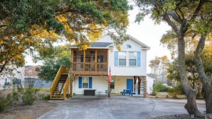 A two-story house with a wooden deck and a front porch. - 5 Min Walk to Nags Head Beach, Centrally Located! (Nags Head)