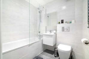 Hair dryer, towels, shampoo, toilet paper