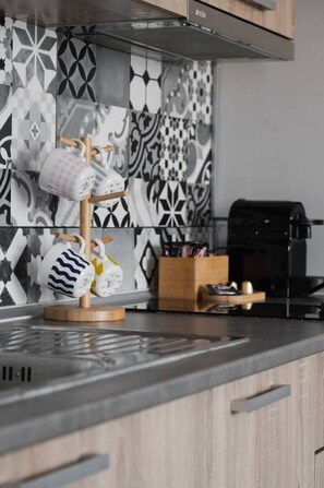 Fridge, microwave, stovetop, coffee/tea maker