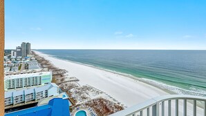 A coastal hotel with a beach view, a pool, and a boardwalk leading to the beach. - Newest Beachfront Complex!!  Professionally Decorated 4BR!!  Lazy River!! (Orange Beach)