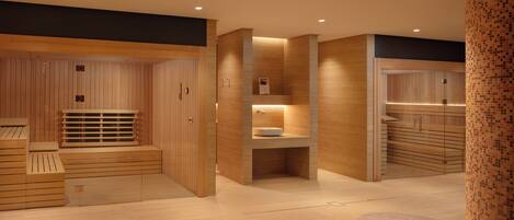 A modern spa area with wooden paneling, a sink, and seating.