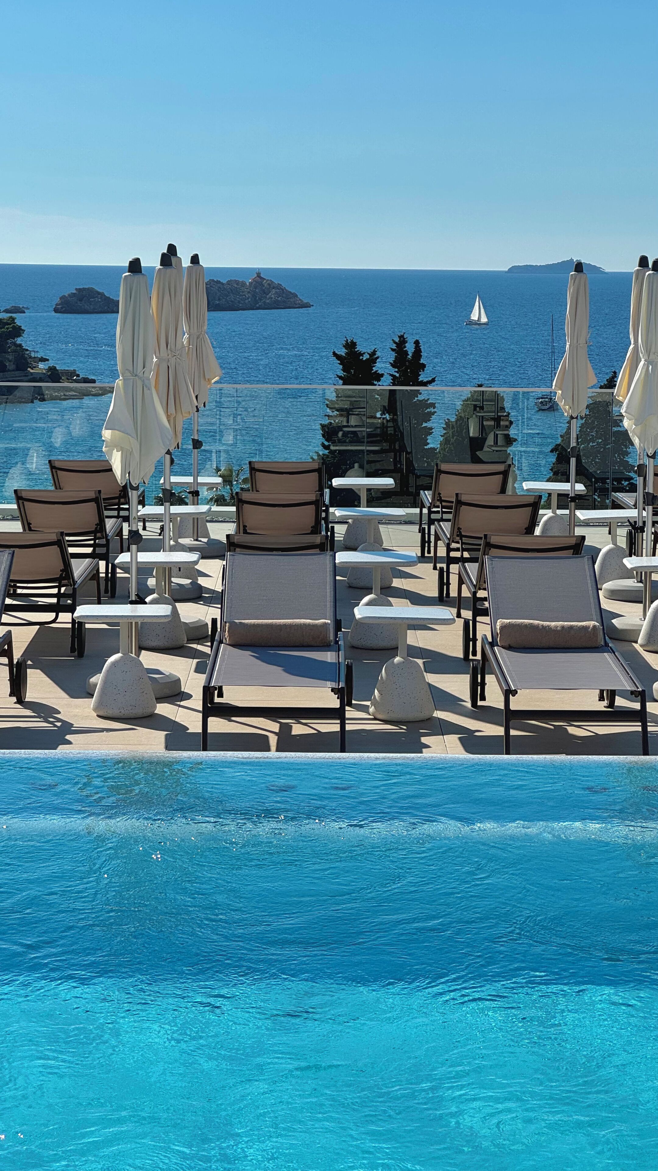 Outdoor pool, pool umbrellas, pool loungers