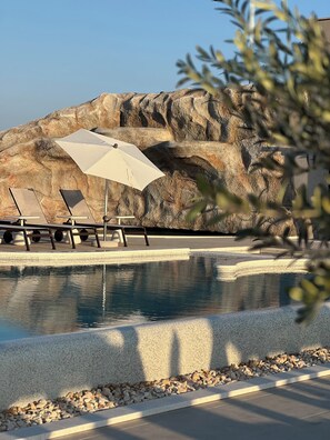 Outdoor pool, pool umbrellas, sun loungers