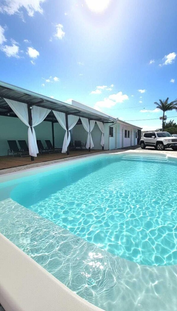 Outdoor pool, open 8:00 AM to 10:00 PM, pool loungers