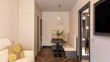 Luxury Apartment | Living area | 50-inch Smart TV with satellite channels