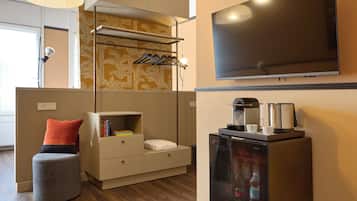 Business Suite | Living area | 50-inch Smart TV with satellite channels