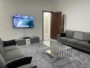 TV - Spacious 6-bedroom apartment in delightful Madinah with WiFi, AC (Unknown)