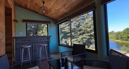 House overlooking private lake in mid-mountain setting. Peace and quiet in the heart of nature!