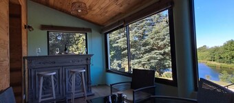 House overlooking private lake in mid-mountain setting. Peace and quiet in the heart of nature!