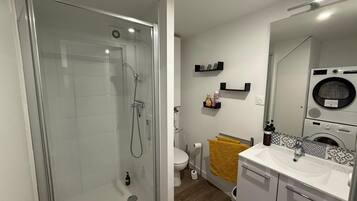 Shower, hair dryer, towels, soap