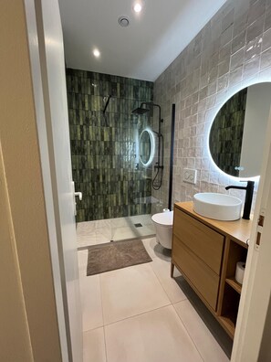 Shower, hair dryer, towels, soap