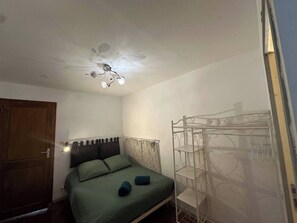1 bedroom, desk, iron/ironing board, travel crib